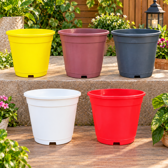 Set of colorful 6 inch plastic flower pots in yellow, pink, grey, white and red for plants