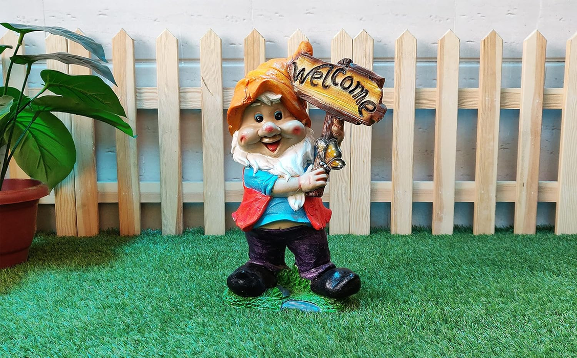 A colorful garden gnome statue wearing an orange hat and holding a rustic Welcome sign
