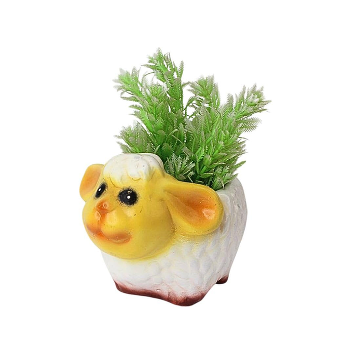 A miniature sheep-shaped planter with a yellow face and white textured body, holding small green artificial plants