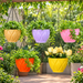 solitaire geometric hanging planter pots with chains in beige purple pink orange and yellow