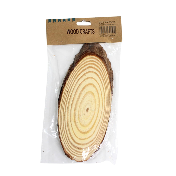 A large, oval-shaped unfinished natural wood slice with visible growth rings and dark bark edges, packaged in a clear plastic sleeve with a brown "WOOD CRAFTS" header card.