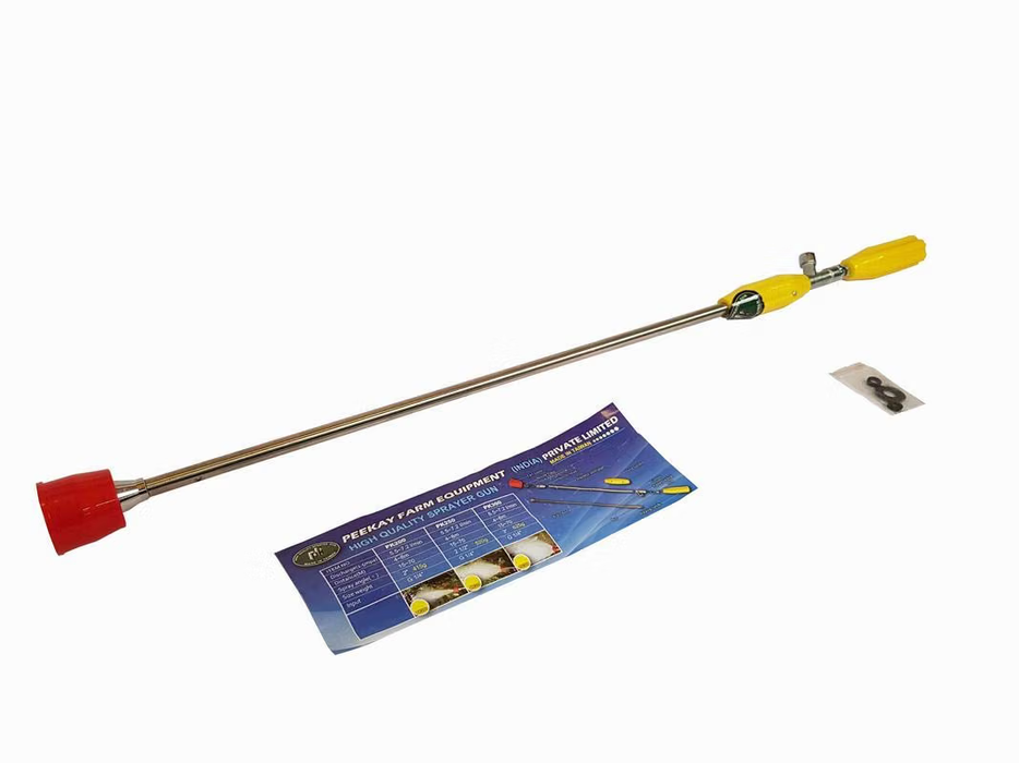 Agricultural sprayer gun with a long metal rod, yellow handle, red nozzle, and an instruction card