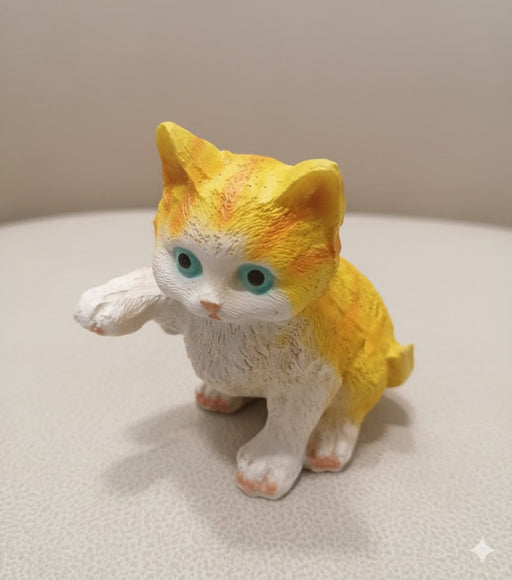 Small, orange and white kitten figurine with bright blue eyes for Garden & Home Décor