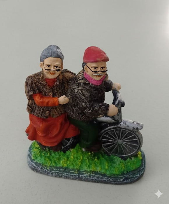 Romantic elderly couple on a bicycle figurine, vintage style home decor statue for grandparents.