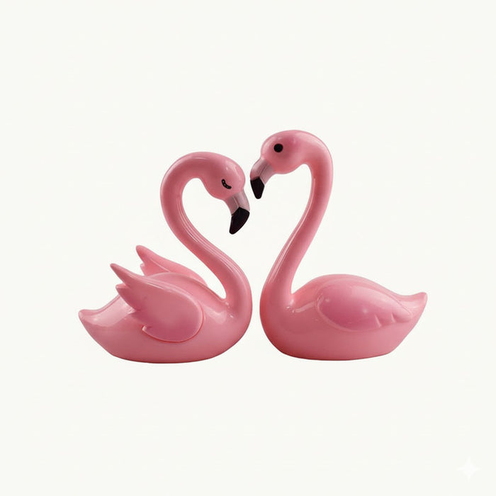 Pink flamingo couple making heart shape with necks, decorative figurine, love symbol.