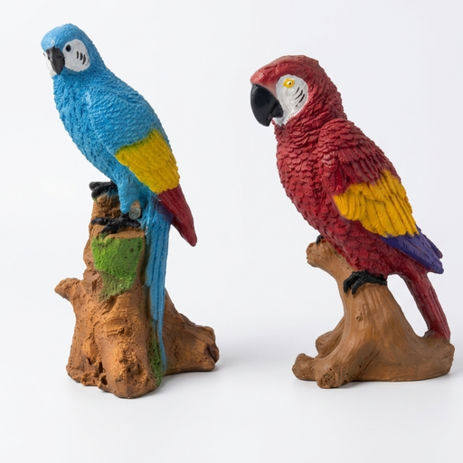 A pair of colorful resin parrot figurines, one blue and one red, perched on realistic brown tree stumps on a display shelf.