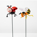 Hand-painted metal garden stakes featuring a red ladybug with black spots and a yellow-and-black striped bumblebee with clear purple-dotted wings, set against a neutral background.