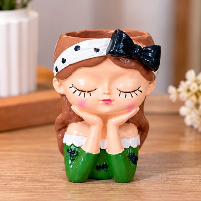 4-inch cute girl face planter in green dress with black bow on a wooden surface for indoor home decor