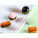Set of 4 miniature fast food resin figurines including colorful burgers, a hotdog, and a sandwich displayed on a white textured plate.