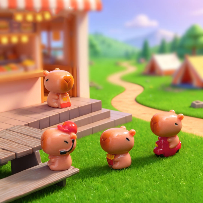 Four glossy miniature capybaras in a campsite setting with a food stand and red scooter on green grass.