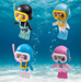 Set of 4 colorful scuba diver miniature figurines with masks, snorkels, and flippers against an underwater