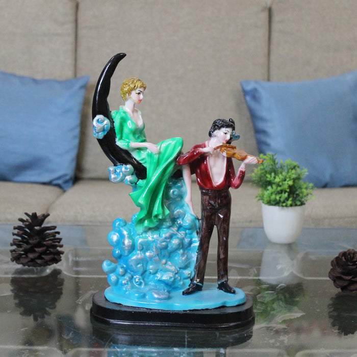 Wonderland Resin Romantic Couple Sitting On Moon Statue Showpiece (Green & Marron )