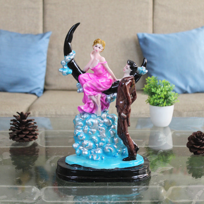 Wonderland Resin Romantic Couple Sitting On Moon Statue Showpiece (Pink & Maroon )
