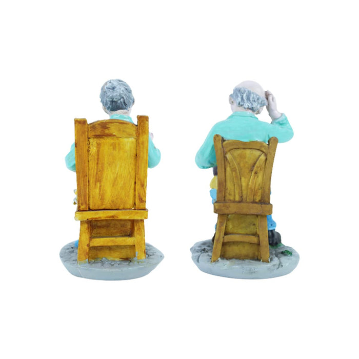 Old Couple Sitting on Chair Statue